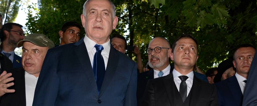 Israeli Prime Minister Benjamin Netanyahu, left, and Ukrainian President Volodymyr Zelensky, right, stand at Babi Yar ravine in Kyiv, Ukraine, Aug. 19, 2019