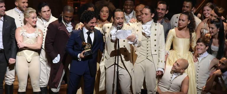 Music director Alex Lacamoire and Actor, composer Lin-Manuel Miranda celebrate on stage during 'Hamilton' GRAMMY performance for The 58th GRAMMY Awards at Richard Rodgers Theater on February 15, 2016 in New York City. (Theo Wargo/Getty Images)