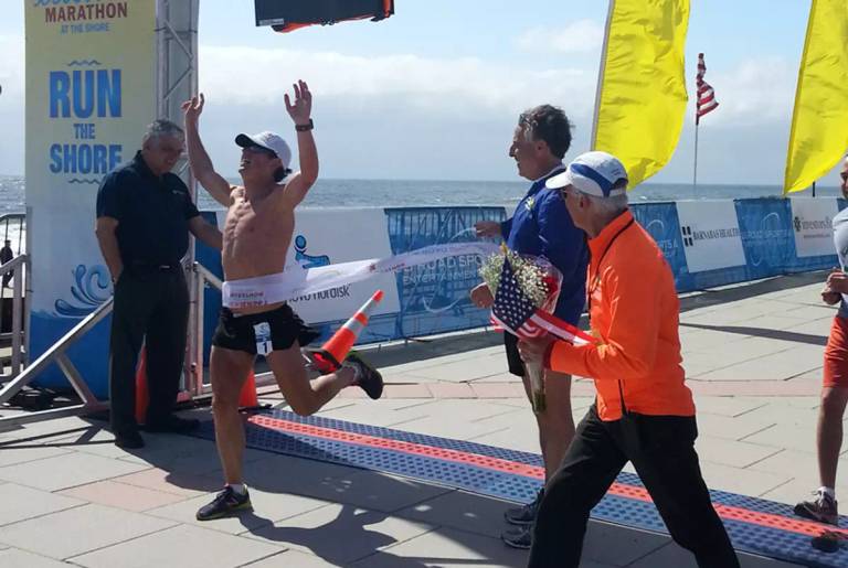 Oz Pearlman crosses the finish line of the New Jersey Marathon. 