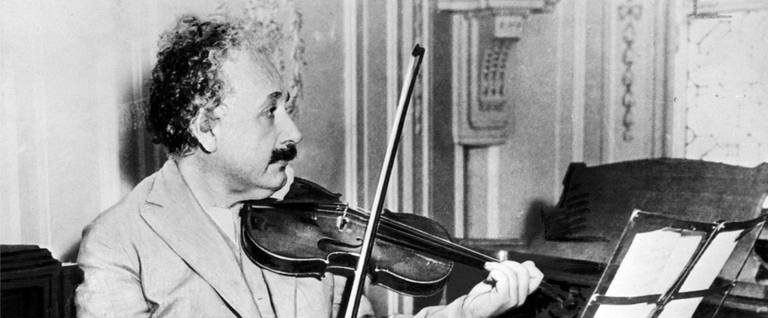 Albert Einstein playing the violin, 1931. 