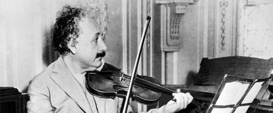 Albert Einstein playing the violin, 1931. 
