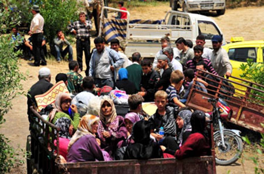 Displaced Syrians in neighboring Turkey.(Mustafa Ozer/AFP/Getty Images)