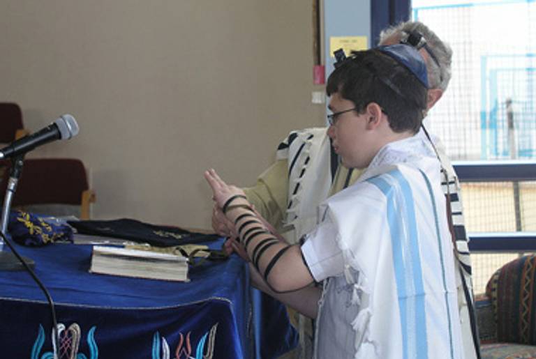 A tefillin-wrapping.(Israeltripsandother/Flickr)