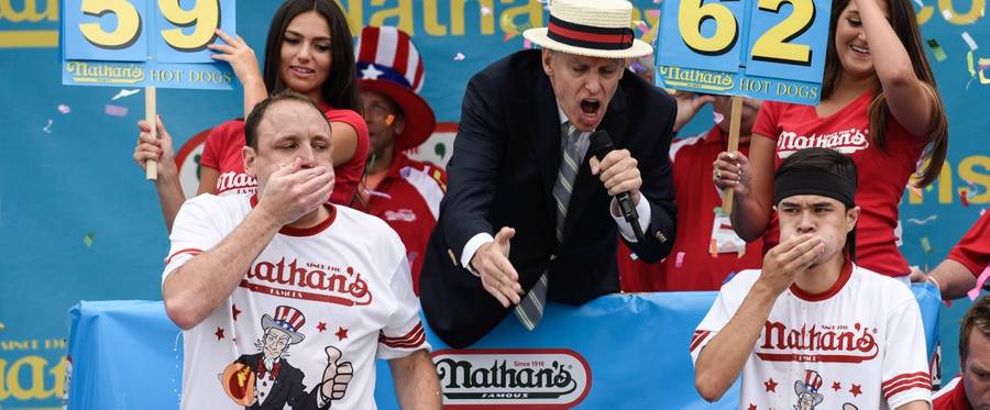 Joey Chestnut (L) is defeated by Matt Stonie at Nathan's Famous Fourth of July International Hot Dog-Eating Contest in Coney Island, New York, July 4, 2015.