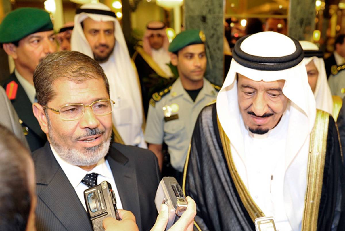 Egyptian President Mohamed Morsi speaks to reporters alongside Saudi Crown Prince Salman bin Abdulaziz upon arrival in Jeddah on July 11, 2012. (AFP/Getty Images)