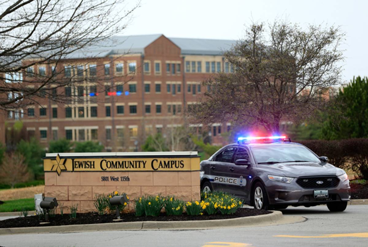A police car is seen at the entrance of the Jewish Community Center after three were killed when a gunman opened fire on April 13, 2014 in Overland Park, Kansas. (Jamie Squire/Getty Images)
