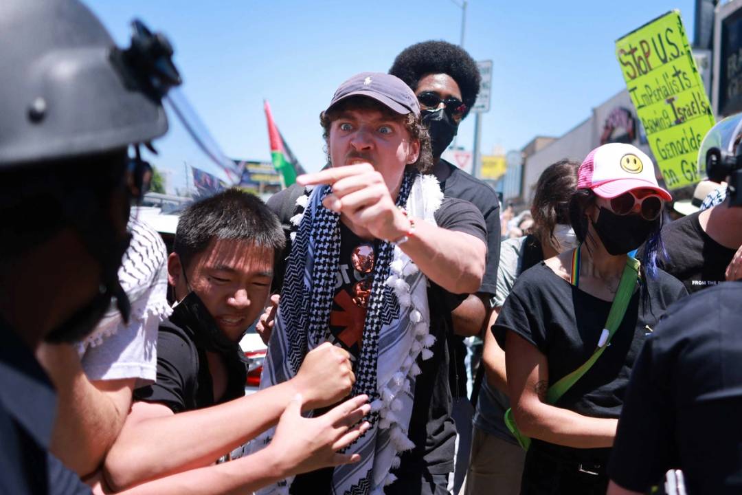 Los Angeles Police Department officers clash with anti-Israel protesters gathered outside the Adas Torah Orthodox Jewish synagogue in Los Angeles, June 23, 2024