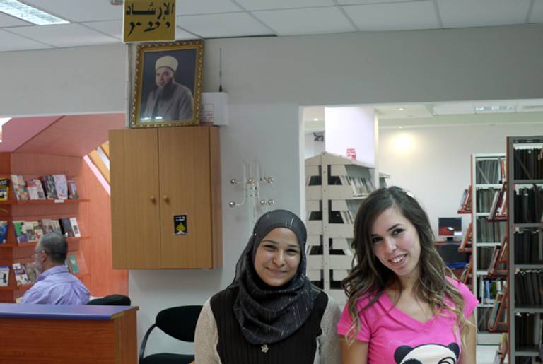 Students Sujud Watan, left, and Rana Ghazail in the Al-Qasemi College library.(Oren Kessler)