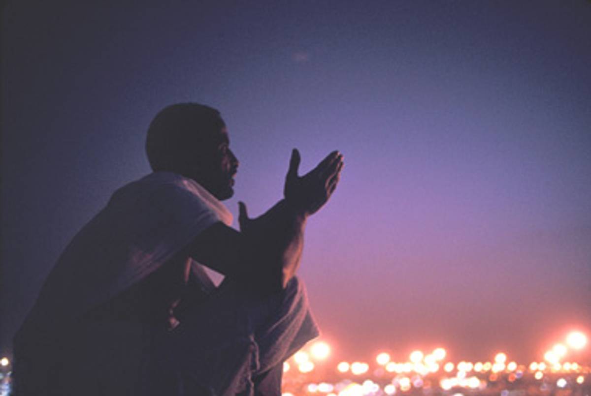 A pilgrim prays at Mecca.(Reza/Getty Images)