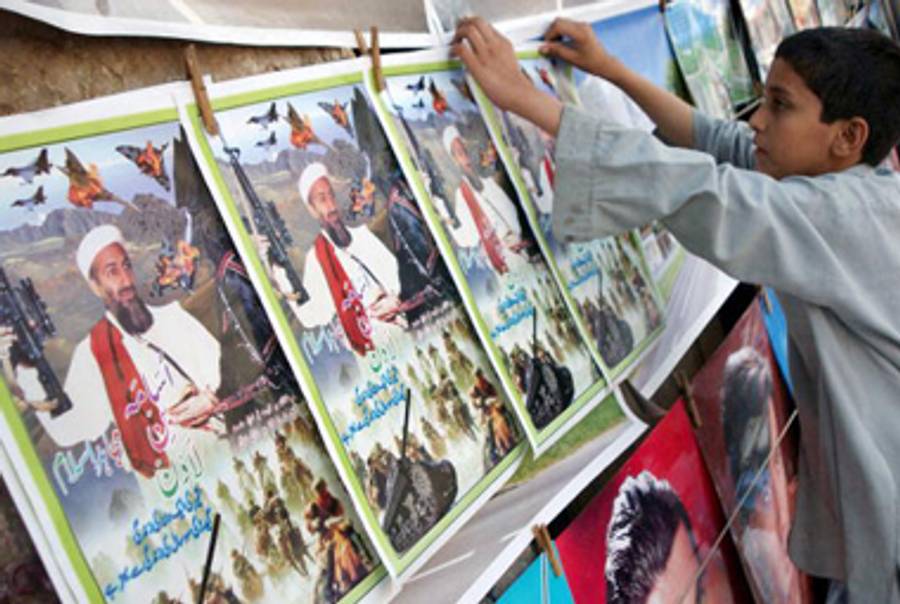 Posters of Osama Bin Laden at a road-side book stall in Pakistan.(Tariq Mahmood/AFP/Getty Images)