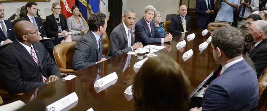 Former President Barack Obama and Secretary of State John Kerry meet with a small group of veterans and Gold Star Mothers to discuss the Iran nuclear deal in the White House, Sept. 10, 2015