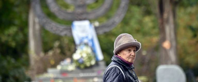 A Ukrainian woman visits the Babi Yar monument in Kiev on September 23, 2016, a few days before Ukraine marks the 75th anniversary of the Nazi massacre of Jews that took place there in September 1941.