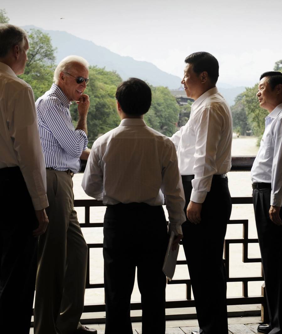 U.S. Vice President Joe Biden and Chinese Vice President Xi Jinping, accompanied by their translators, talk on the Dujiangyan Irrigation System in Dujiangyan outside Chengdu in China’s southwest province of Sichuan on Aug. 21, 2011