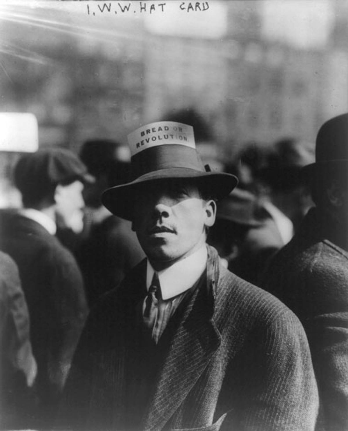 Ian Turner, of the IWW committee, wearing a hat with a card labeled ‘Bread or Revolution’ stuck in the brim (Photo: Library of Congress)