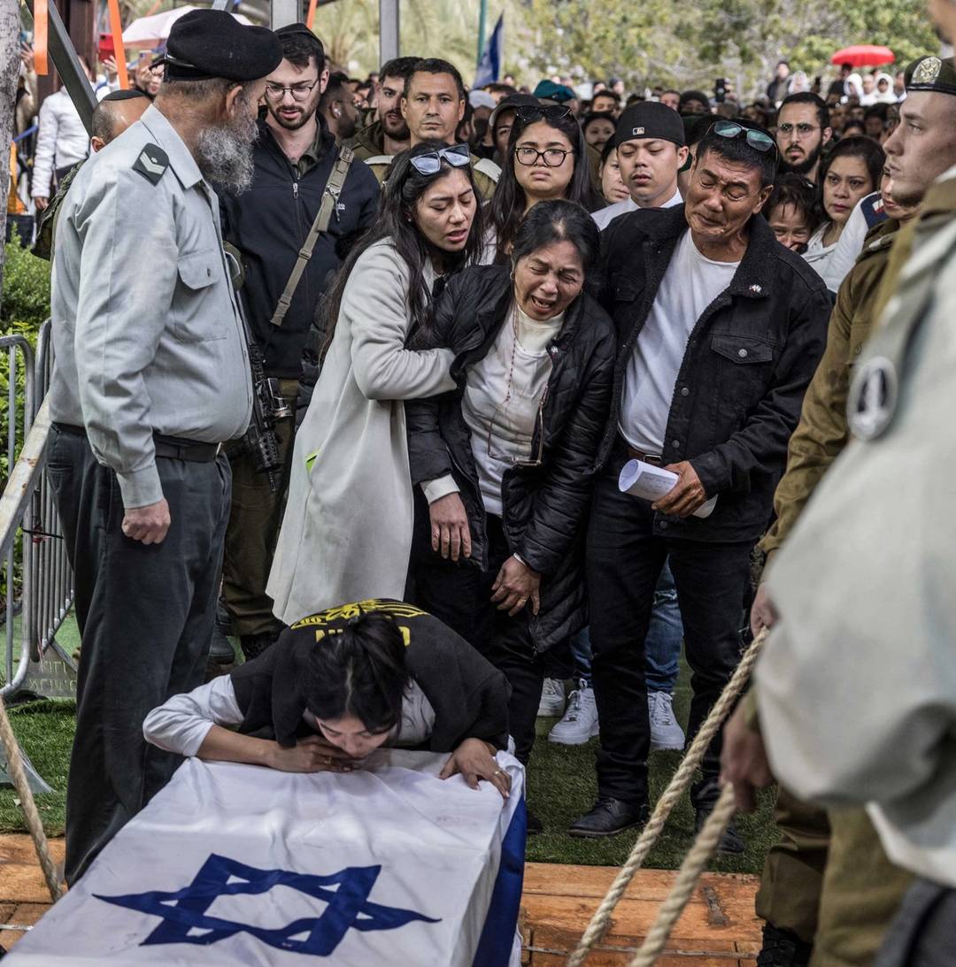 Cydrick Garin's family at his funeral at the Kiryat Shaul Cemetery in Tel Aviv on Jan. 25, 2024