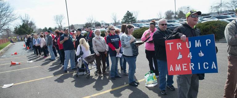 Supporters of Republican presidential candidate Donald Trump wait in line to enter a campaign rally at the Holiday Inn Express hotel in Janesville, Wisconsin, March 29, 2016.  