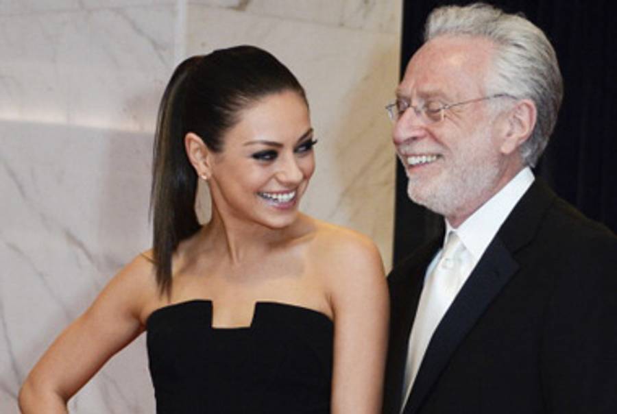 Wolf Blitzer with Mila Kunis at April’s White House Correspondents’ Dinner.(Kris Connor/Getty Images)