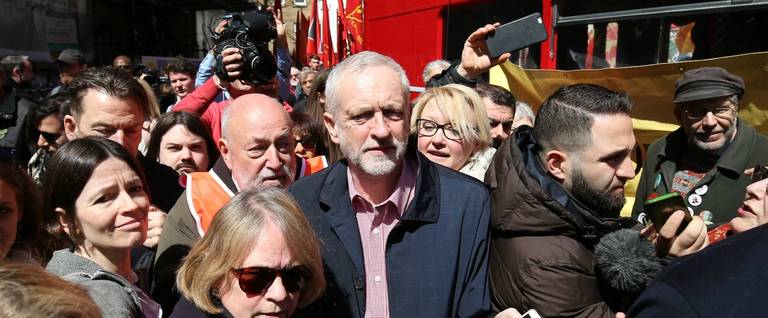 Britain's opposition Labour Party leader Jeremy Corbyn (C) leaves after giving a speech at a May Day rally in London, England, May 1, 2016. 