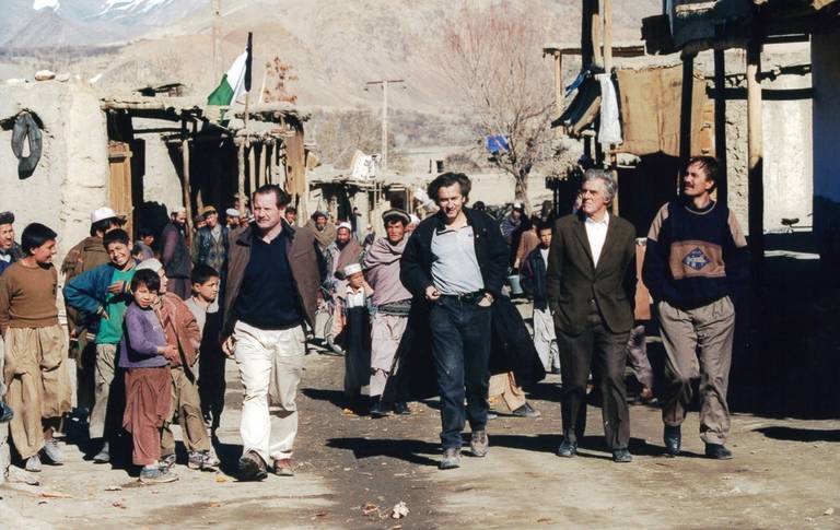 The author, at center, with Gilles Hertzog, second from right, and Frédéric Tissot, left, in a village on the road to Bamiyan in 2002