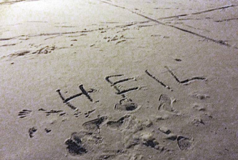 A swastika and the word “HEIL” drawn in snow in a synagogue car park, Greater Manchester, January 2013. (Community Security Trust)