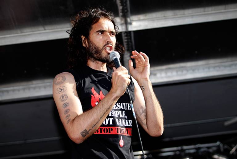 Comedian Russell Brand speaks to a crowd of demonstrators in Parliament Square in London, England on June 21, 2014 . (Mary Turner/Getty Images)