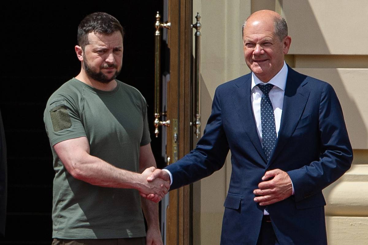 Ukrainian President Volodymyr Zelensky shakes hands with German Chancellor Olaf Scholz on June 16, 2022 in Kyiv, Ukraine.