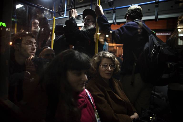 Israeli women sit at the front of a bus in defiance of demands by hardliners that women sit at the back, in Jerusalem on Jan. 1, 2012.(Menahem Kahana/AFP/Getty Images)