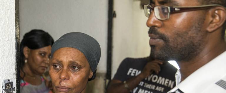 The brother and mother of Avraham Mengistu in Ashkelon, Israel, July 9, 2015. 