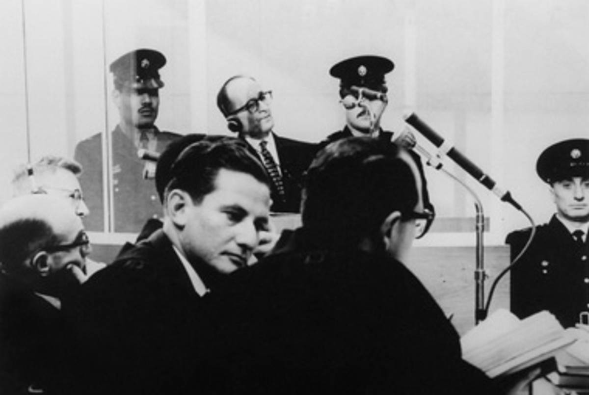 Adolf Eichmann listens to the proceedings during his trial in Jerusalem, 1961.(Israel Government Press Office via United States Holocaust Memorial Museum)