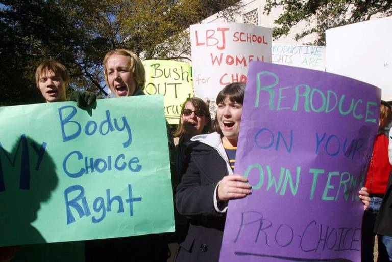 Students from the University of Texas hold signs during a rally in favor of abortion rights Nov. 24, 2003, in Austin, Texas.
