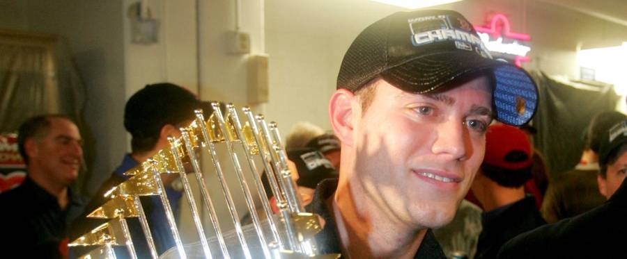 General Manager Theo Epstein celebrates in the Red Sox locker room after his team won the World Series over the St. Louis Cardinals, October 27, 2004. 