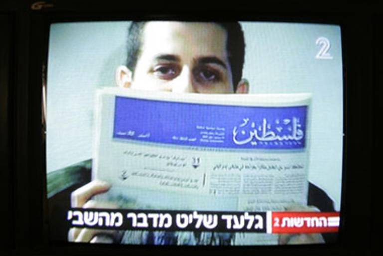 Shalit holding a Gaza newspaper in a video shown on Israeli TV last month.(Jonathan Nackstrand/AFP/Getty Images)