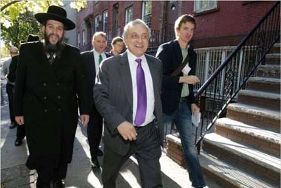 Rabbi Levin (L) and Carl Paladino (front).(NYT)