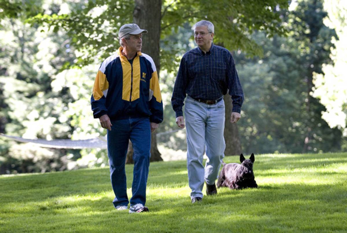 President George W. Bush and Chief of Staff Josh Bolten walk with the president's dog, Barney, July 21, 2007, at Camp David, Md. (Eric Draper/White House via Getty Images)