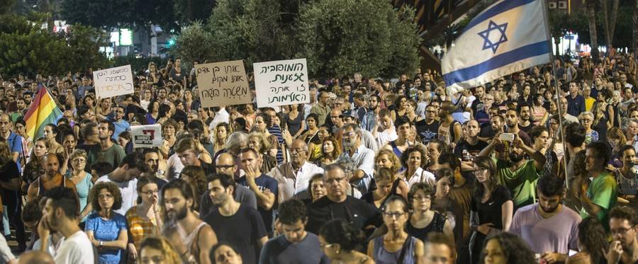 Israelis take part in a demonstration in Tel Aviv, two days after the death of 18-month-old Ali Saad Dawabsha, a Palestinian toddler who was burned to death by suspected Jewish extremists, August 2, 2015. 