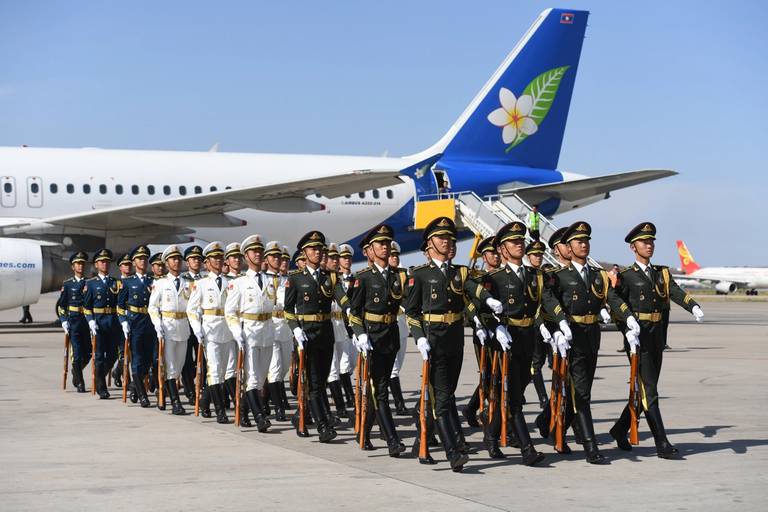 A Chinese military honor guard marches off after greeting Laotian President Bounnhang Vorachith (not seen) on his arrival at Beijing airport to attend the Belt and Road Forum, on April 25, 2019