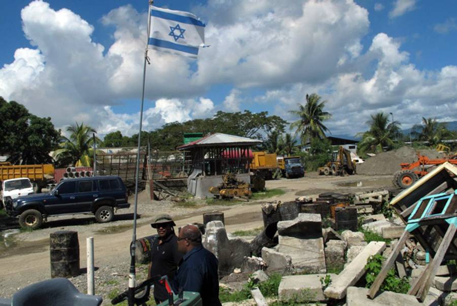 Leliana Firisua, honorary consul of Israel in the Solomon Islands (in blue), at the headquarters of an Israeli-friendly road construction company in the capital, Honiara.(Matthew Fishbane)