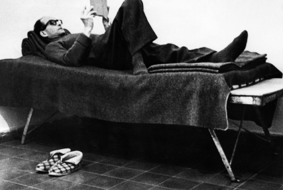 Adolf Eichmann reads a book in his cell near Nazareth, a few days before the start of his trial in Jerusalem on April 11, 1961.(AFP/Getty Images)