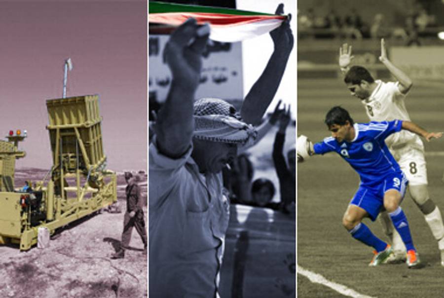Iron Dome, March 27; Land Day, March 30; Israel-Georgia soccer, March 29.(David Buimovitch/AFP/Getty Images; Menahem Kahana/AFP/Getty Images; Jack Guez/AFP/Getty Images)