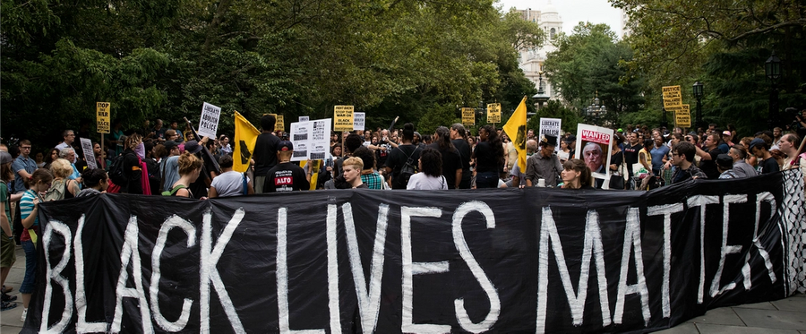 Protestors rally during a protest against police brutality at City Hall Park in New York City, August 1, 2016. 