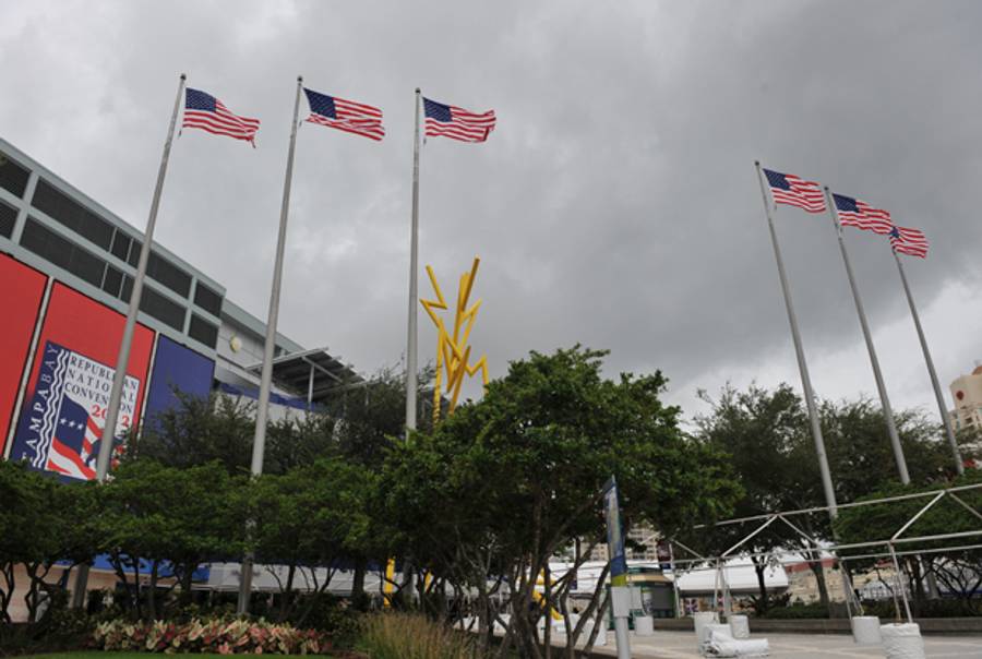US flags in front of the Tampa Bay Times Forum, Florida, flutter in the wind on August 26, 2012.(STAN HONDA/AFP/GettyImages)