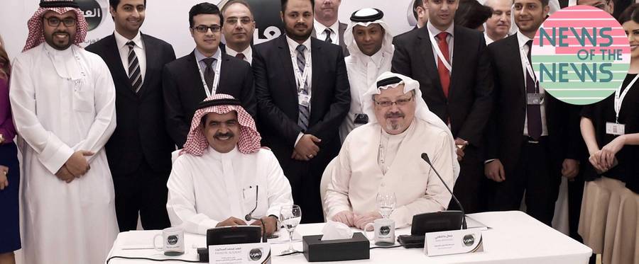 Jamal Khashoggi (seated, right), with chairman and chief executive of Alarab TV, Fahad al-Sukait (seated, left), and members of the Alarab TV team, pose for a picture following a press conference in the Bahraini capital Manama, on Dec. 15, 2014. 