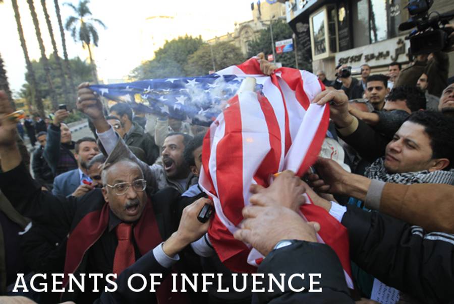 Demonstrators set an American flag on fire outside the American embassy in Cairo on Jan. 7, 2012.(Mohammed Abed/AFP/Getty Images)