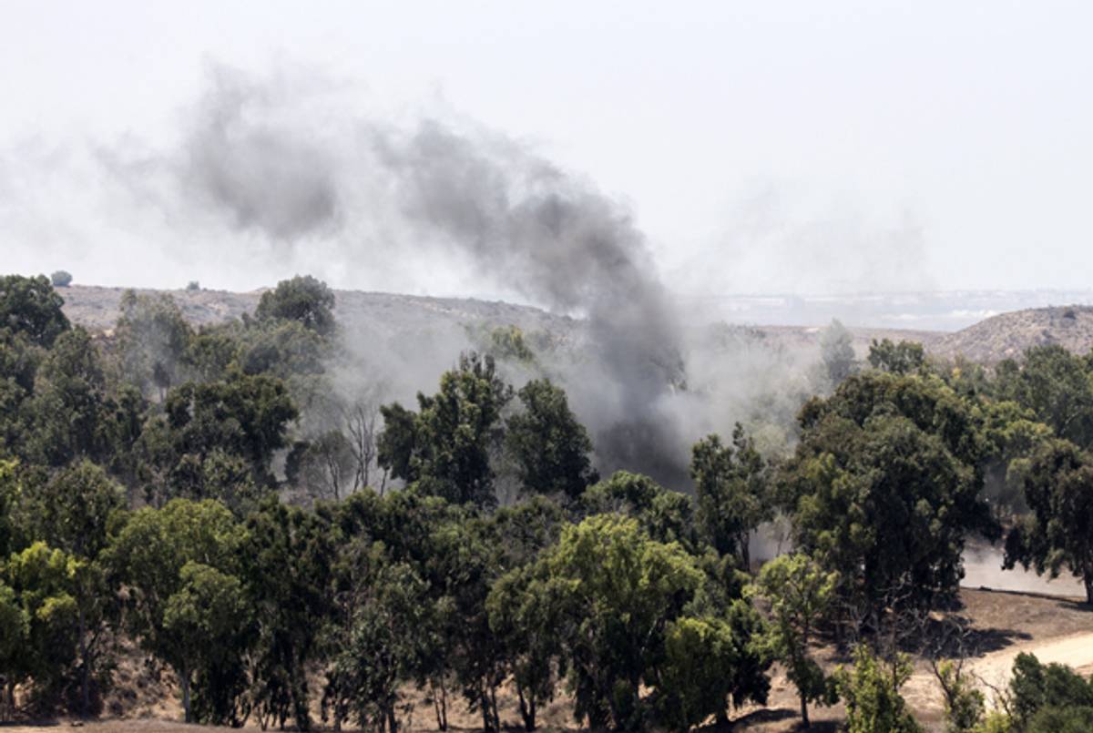A picture taken from the southern Israeli border with the Gaza Strip shows smoke rising from the remains of a mortar fired by Palestinian militants into Israel on August 22, 2014. (JACK GUEZ/AFP/Getty Images)