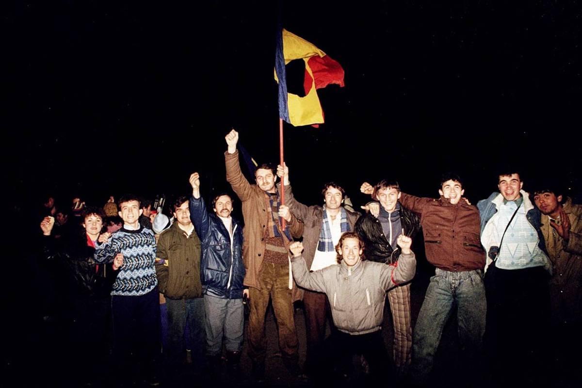 Romanian people celebrate after the fall of Communist dictator Nicolae Ceauşescu, on Dec. 22, 1989, in Timişoara, Romania (Photo: The Asahi Shimbun via Getty Images)