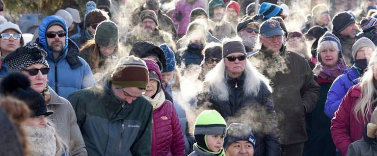 Hundreds of people brave below-zero temperatures Saturday morning to gather in downtown Whitefish, Montana, for the 'Love Not Hate' event, January 7, 2017. 
