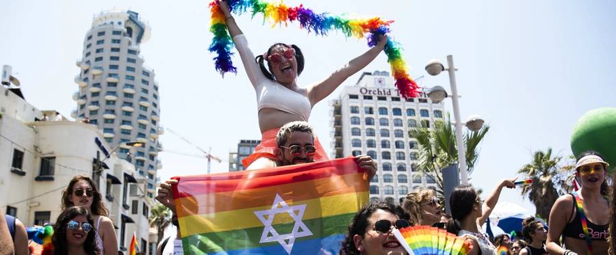 Revelers take part in the annual Gay Pride Parade on June 14, 2019, in Tel Aviv, which drew tens of thousands of Israelis and tourists 