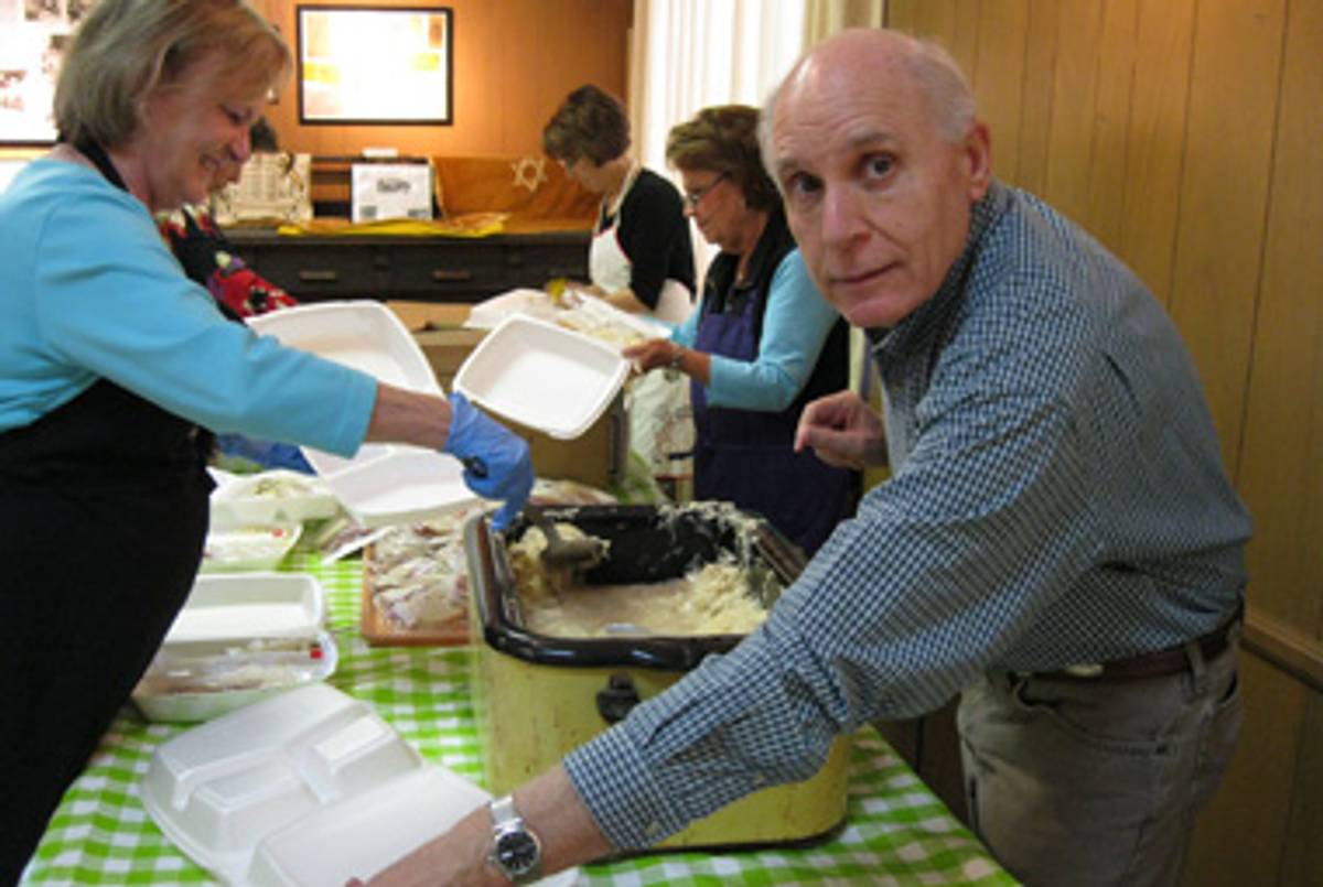 Hebrew Union volunteers Rebecca Barrett, Pat Kline, and Phil Kline, preparing take-out orders for the annual deli luncheon.(Philip Graitcer)