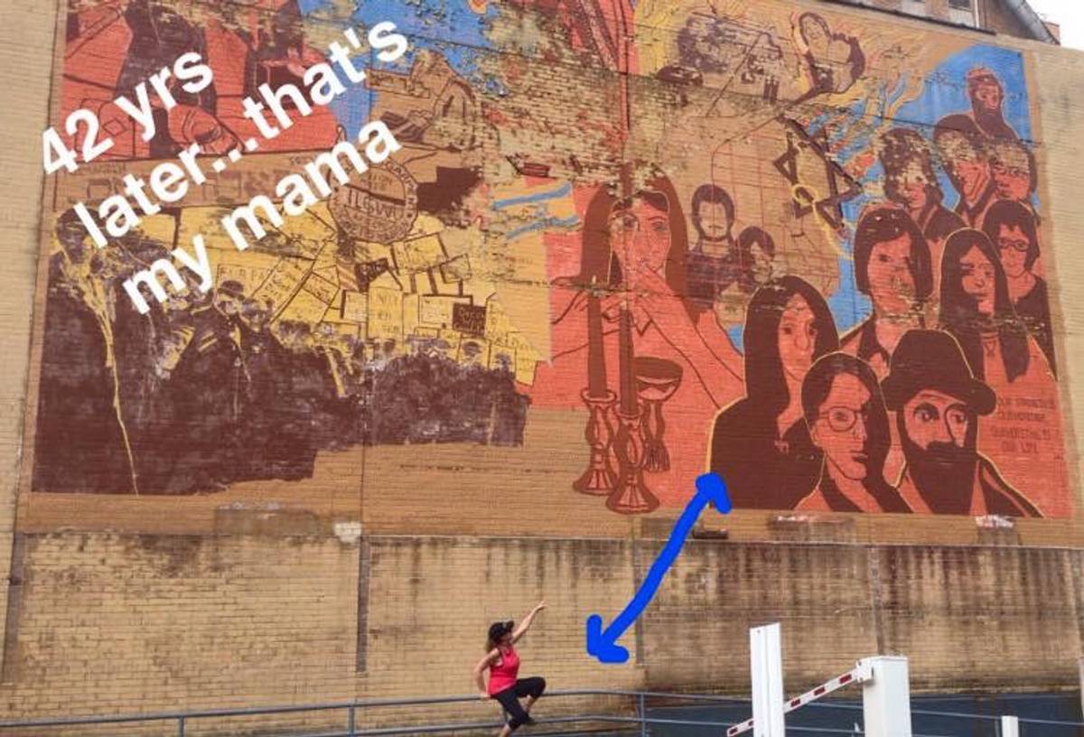 Sara Krivisky pointing at herself in the mural. (Image: Ariel Krivisky)