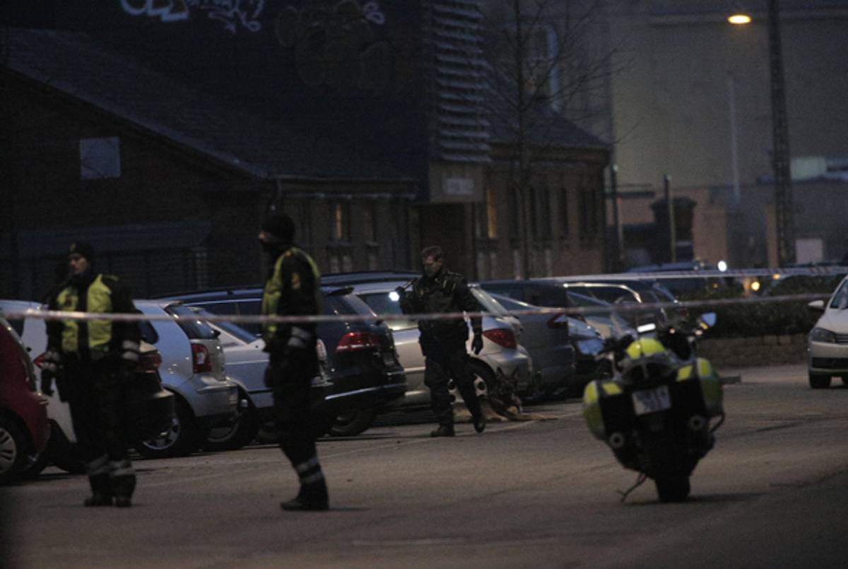 Policemen secure the area around a building in Copenhagen, Denmark, where shots were fired on February 14, 2015 outside the venue of a debate held on art and free speech. (MARTIN SYLVEST/AFP/Getty Images)